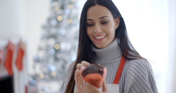 Pretty Young Woman Enjoying Her Christmas Baking alt