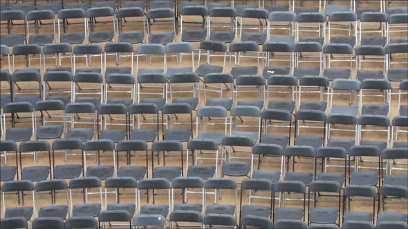 Lots of Blue Gray Chairs Lined  Up