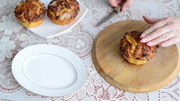 Woman Cuts Hot Homemade Cupcake