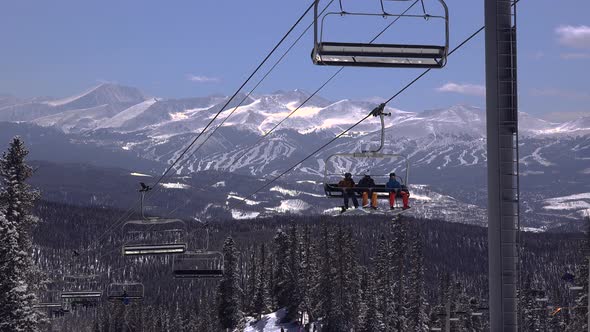 Ski Chairlift With Slopes In Background