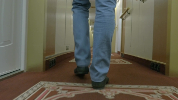 Fast Walking Man Along A Corridor Of Ocean Cruise alt