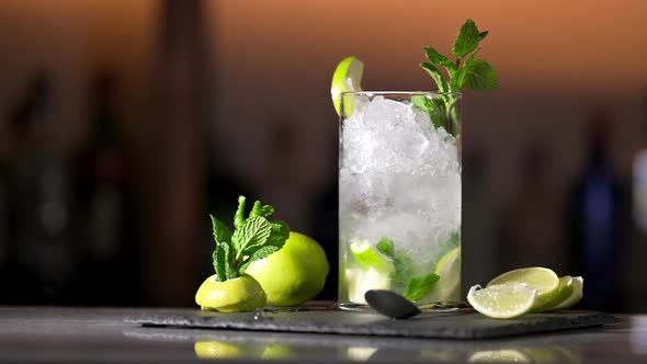 Delicious Fresh Mojito Cocktail with Ice Lime and Mint Closeup Dolly Shot alt