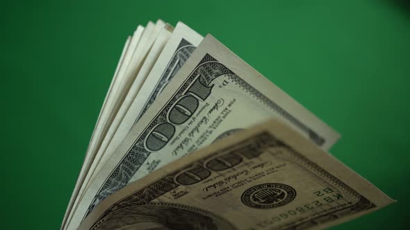Lot Of 100 Dollar Bills Isolated On Chroma Key Green Screen Background alt