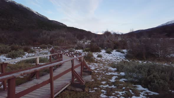 PAN RIGHT Wooden walkway and Lapataia Bay on Tierra del Fuego National Park alt