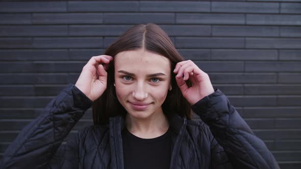 Charming Young Woman with a Magnificent Big Blue Eyes, She Turns To Camera and Smiles. alt