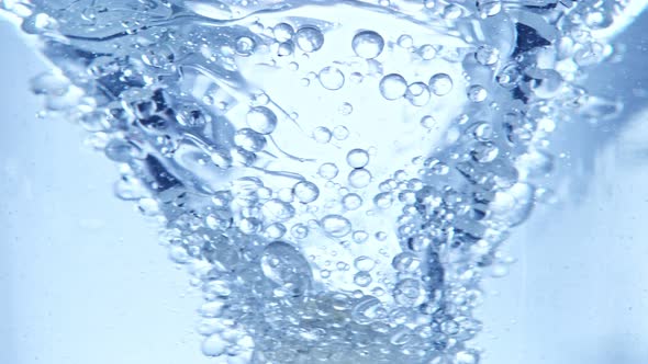 Super Slow Motion Shot of Oil and Water Blue Whirl at 1000Fps alt