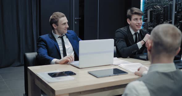 Young Businessman is Discussing with a Company Business Partner