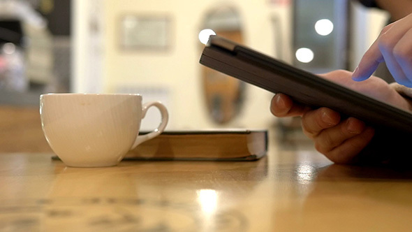 Using a Tablet in a Coffee Shop