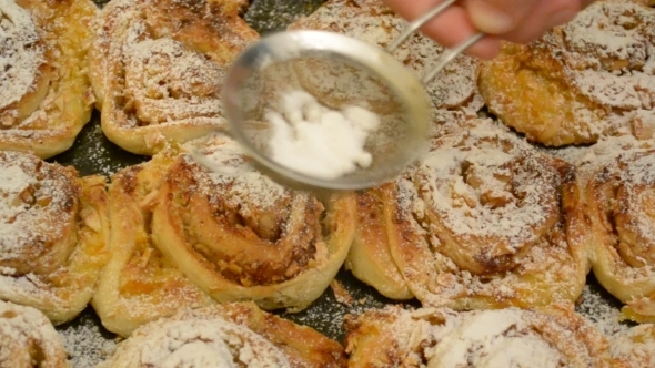 Sifting Icing Sugar Onto Buns