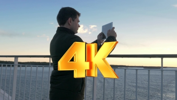 Adult Man With Tablet On Cruise Ship alt