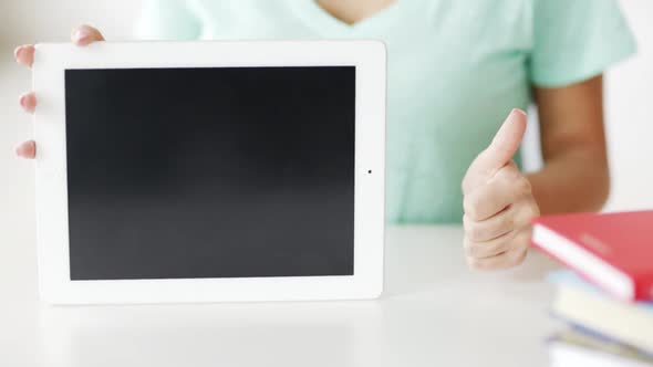 Woman Showing Something On Tablet Pc Screen alt