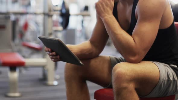Young Man With Tablet Pc Computer In Gym 2 alt