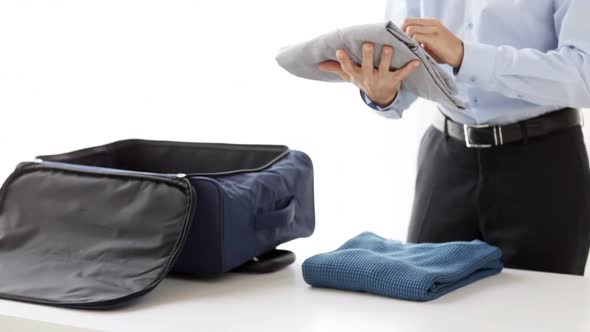 Businessman Packing Clothes Into Travel Bag 5 alt