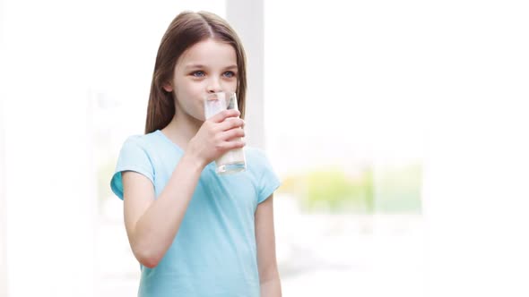 Happy Smiling Little Girl Drinking Milk At Home 1 alt