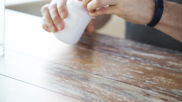 Close Up Of Man With Fish Oil Capsules Jar 1 alt
