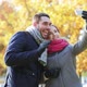 Smiling Couple With Smartphone In Autumn Park 4 - VideoHive Item for Sale