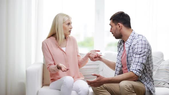 Unhappy Couple Having Argument At Home 10 alt