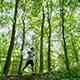 Young Man In Sportswear Running Through Trees - VideoHive Item for Sale