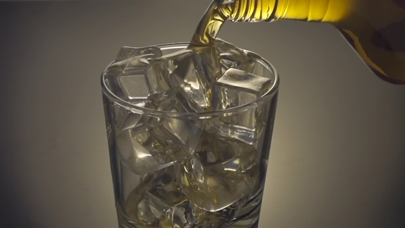 Whiskey Being Poured Into a Glass 