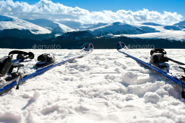 Skis and equipment on mountain slope in winter season. Winter la