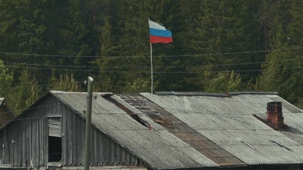 Flag of Russia on The Roof of Wooden Rural House