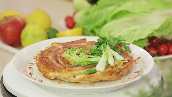 Onion Pie With Bacon On a Kitchen Board  alt