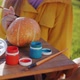 A Child Paints a Pumpkin Prepares Decorations for Halloween - VideoHive Item for Sale