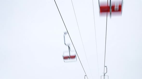 Ski Lift Skiers and Snowboarders Resort in Carpatian Mountains Time Lapse alt