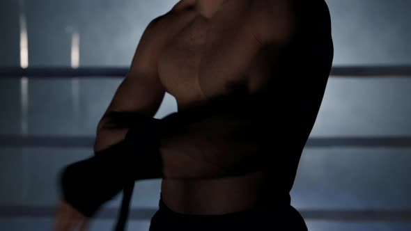 Fighter Wraps His Hands with Boxing Bandages Kickboxing Training Day in a Gym alt