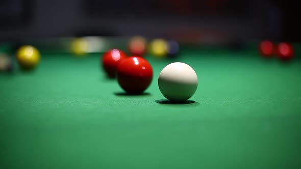 Balls on a green table during a billiards match