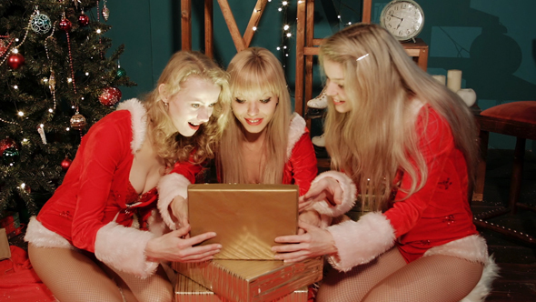 sexy girls opens christmas gift by yurazommer videohive girls christmas