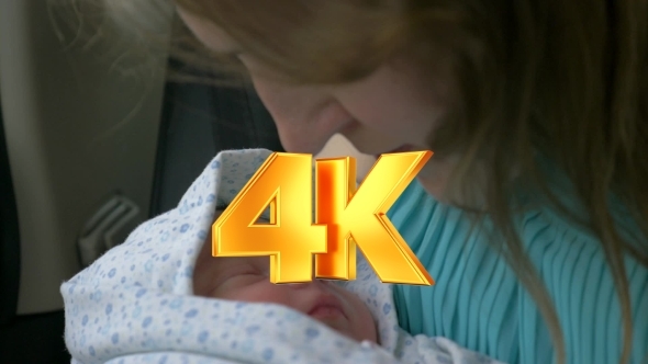 New Born Baby Sleeping In Mothers Hands alt