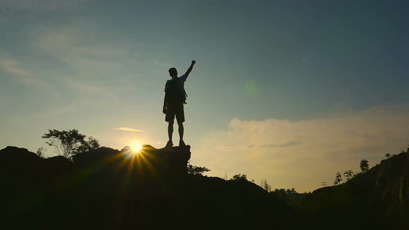 Man Silhouette Celebrating On A Mountain Top, Stock Footage | VideoHive