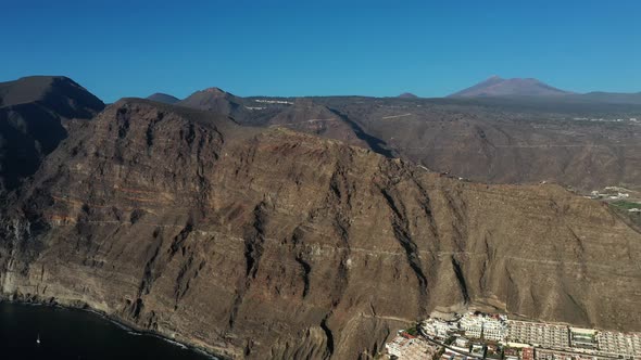 Aerial panorama of Acantilados de Los Gigantes Cliffs of the Giants at sunset, Tenerife, alt