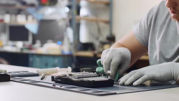 Repairman Wipes Processor of Graphics Chipset Putting Thermal Paste at Workshop