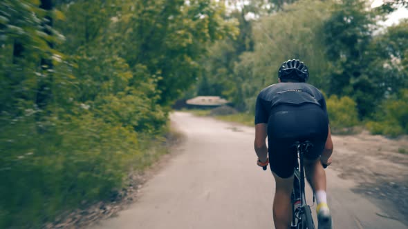 Fit Athlete Workout Training Cycling For Triathlon Competition. Sport Recreation Concept. Road Bike. alt