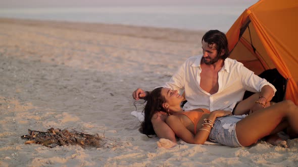 Romantic Couple Near a Tent on the Beach alt