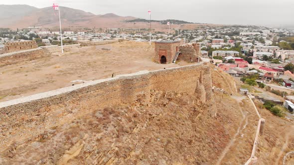 Female Tourist Standing On Top Of Gori Castle And Takes Selfie On Vacation  alt
