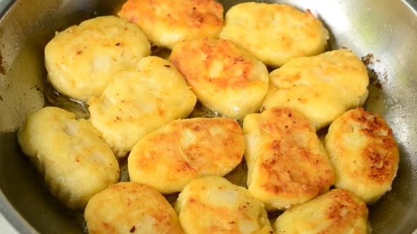 Cottage Cheese Pancakes Fried On a Pan In Oil