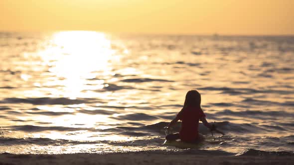 Little Girl Wants to Sit on the Surfboard