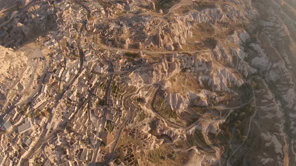 Cappadocia Aerial Shot of Rock Chimneys and Uchisar Castle in Goreme Turkey alt