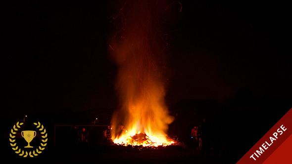 People Staring at a Big Bonfire