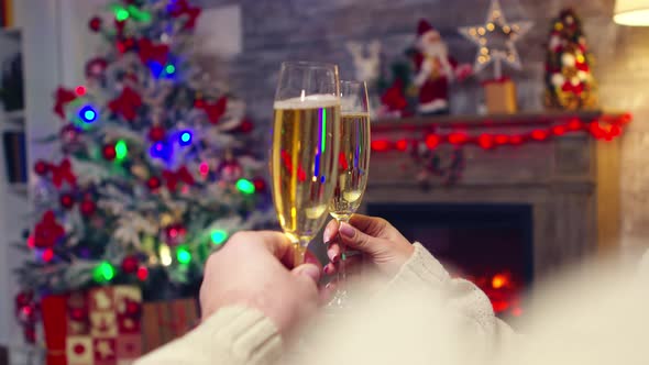 Close Up of Sparkling Champagne Hold By Couple alt