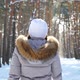 Back View of Woman Walking in Sunny Snowy Forest - VideoHive Item for Sale