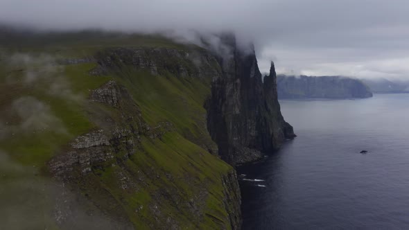 Drone Along Coastline Over Vagar With Trollkonufingur alt