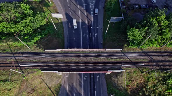 Aerial View of Empty Doubletrack Railway Line Leading Through Town alt