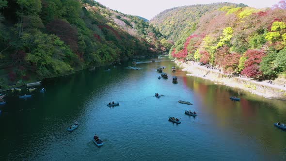 Katsura river at autumn and boats. Arashiyama, Kyoto, Japan alt
