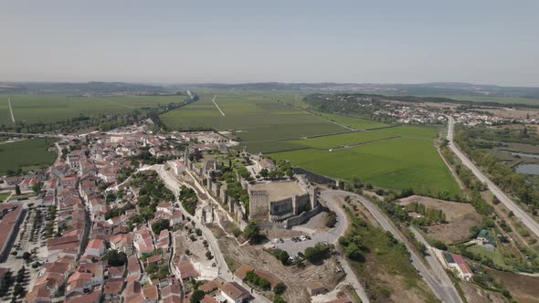 Montemor o Velho castle and surrounding landscape, Portugal. Aerial orbiting