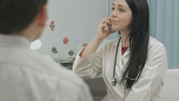 doctor-having-an-important-phone-call-in-medical-stock-footage-videohive