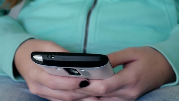 Girl Typing Or Texting Message By Smartphone alt